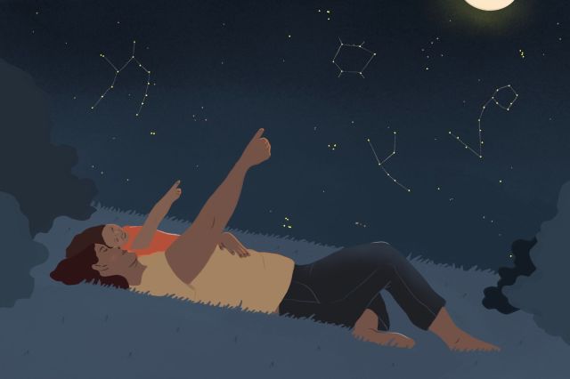 parent and child looking at the stars