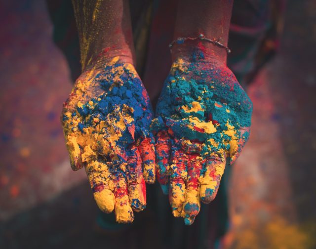 handful of colors at a Holi celebration