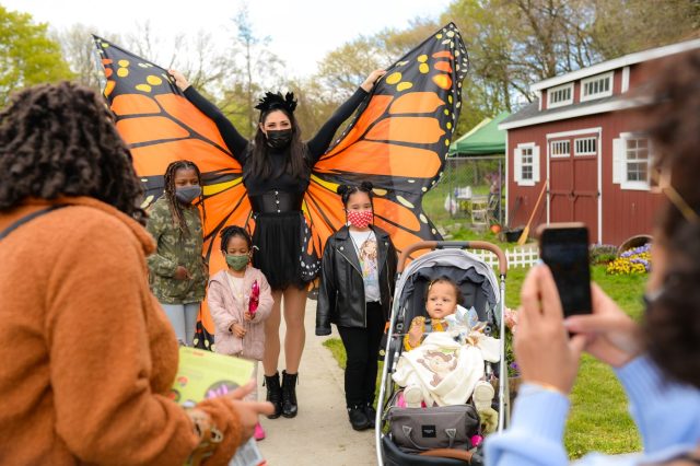 Woman dressed as butterfly with kids at Queens Botanical Garden
