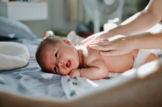 Asian baby getting a massage - newborn resources for new parents