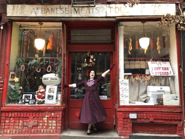 woman on ms. maisel tour in front of butcher shop