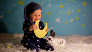 baby holds moon astrology names for babies