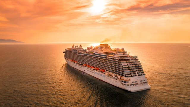 Cruise ship sailing into sunset