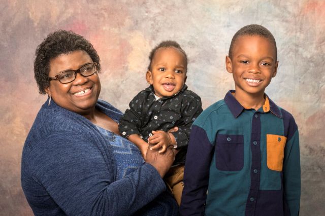 Portrait of a smiling African American mother with her two sons
