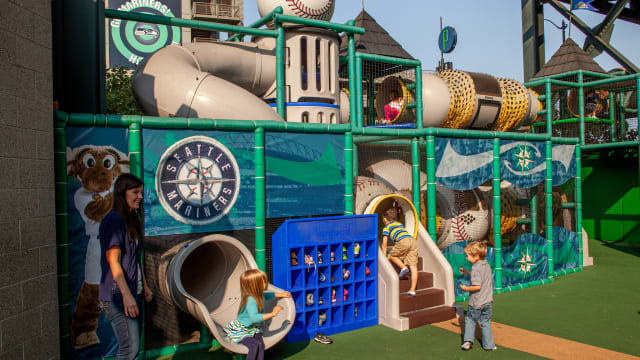 Kids play at the Kids Playfield at T-Mobile Park