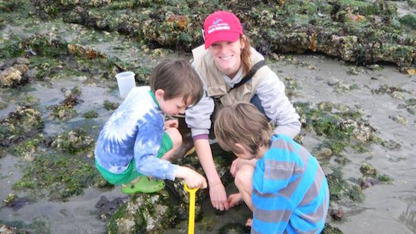 best seattle tidepool beaches include beach naturalists with kids on the shore