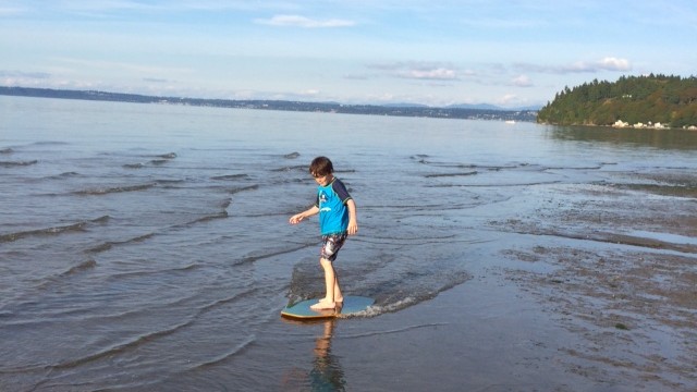 skimboarding at one of the best south sound beaches dash point