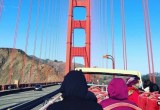 Riders on Big Bus cross the Golden Gate Bridge