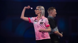 woman playing darts