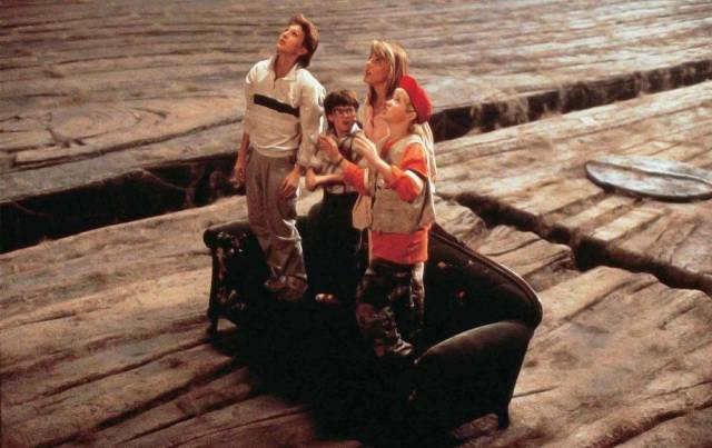 four children stand on a couch in "Honey, I Shrunk the Kids," a classic family movie on Disney+