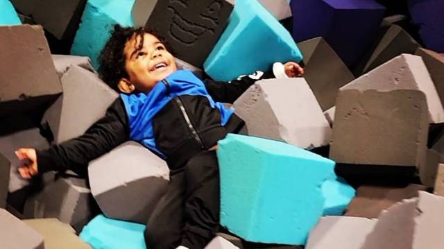 a boy plays in the soft foams at defy an indoor kids birthday party spot in seattle