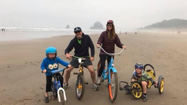 A family bikes on the Oregon coast during their Memorial Day road trips near Seattle
