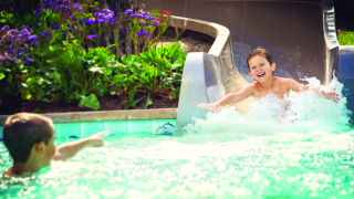 kid swimming in pool with day passes in la