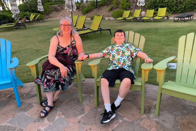 mother and son sitting in chairs on puerto rico family vacation