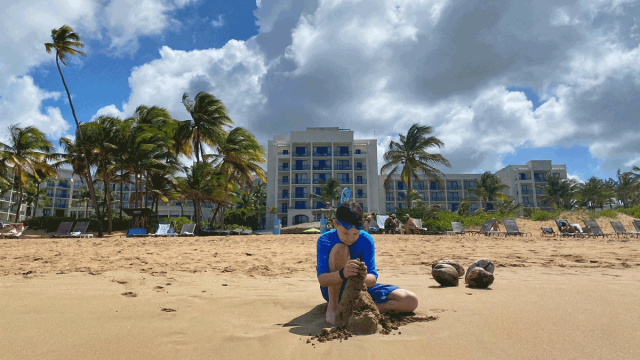 boy playing on beach on puerto rico family vacation at Wyndham Grand Rio Mar