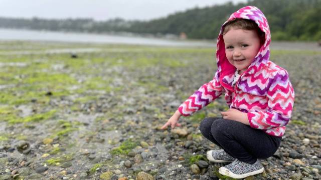 a girl at seahurst beach is one of seattle's best tidepool beaches