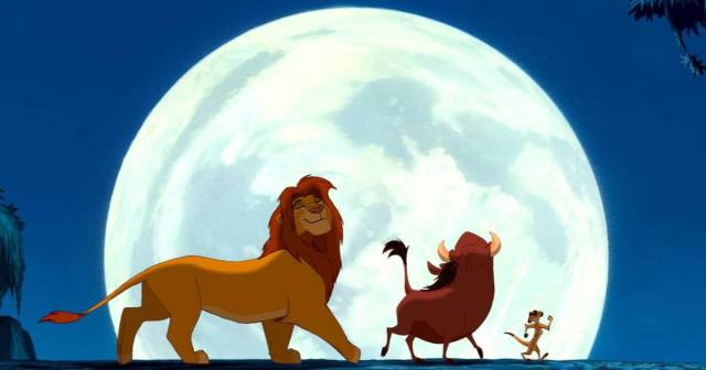 Simba the lion walks in front of the moon in "The Lion King," a great family movie on Disney+