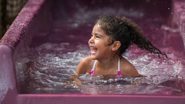 A young girl goes down the slide at Wild Waves Theme and Water Park outside Seattle