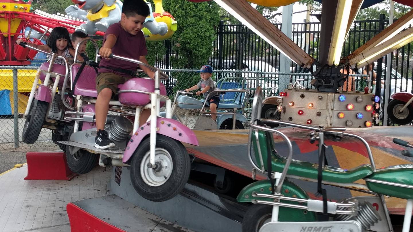 kids on motorcycle ride at adventurers park in brooklyn
