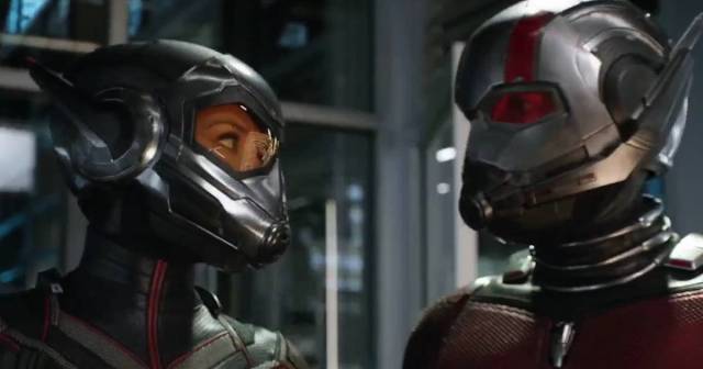 Ant-Man and the Wasp look at each other through helmets