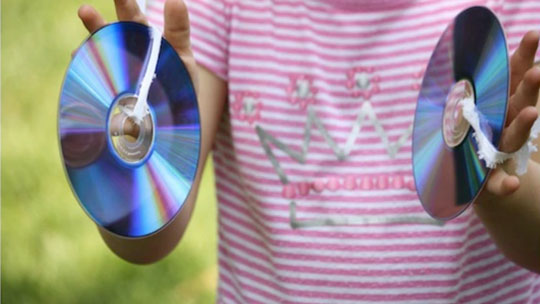 picture of little girl using homemade CD symbols
