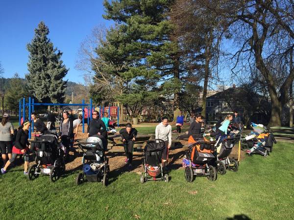 A group of moms with strollers take on a fitness class