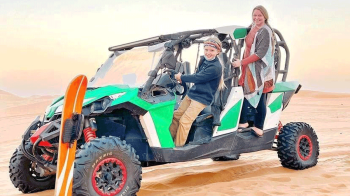 mother and son on jeep in the desert