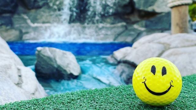 smiley face golf ball on the King Family Fun Center mini golf course in Seattle