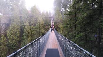 during weekend trips from seattle people cross the capilano bridge in Vancouver bc