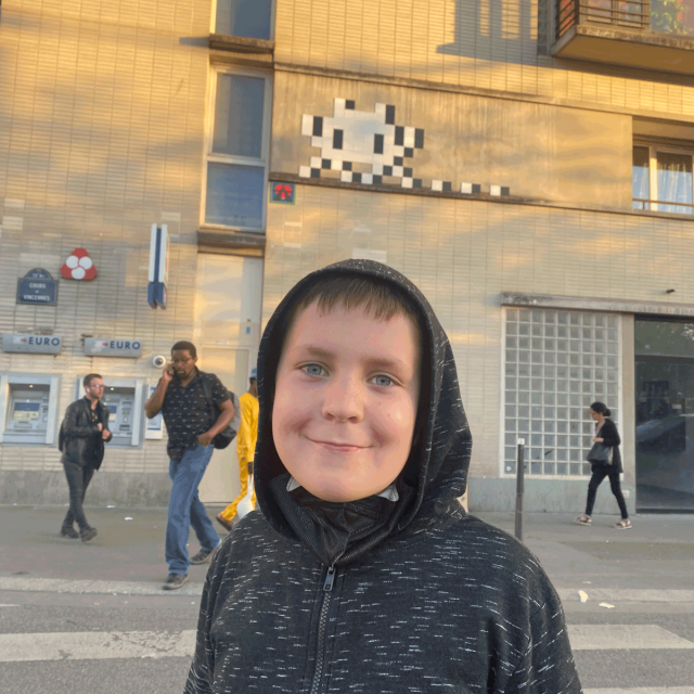 Kid in Paris finding Flash Invaders