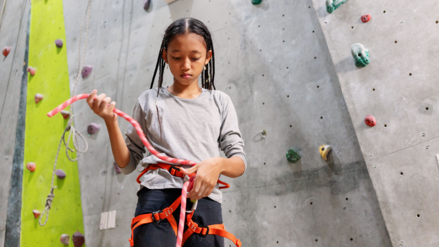 young girl at an indoor climbing gym in dallas