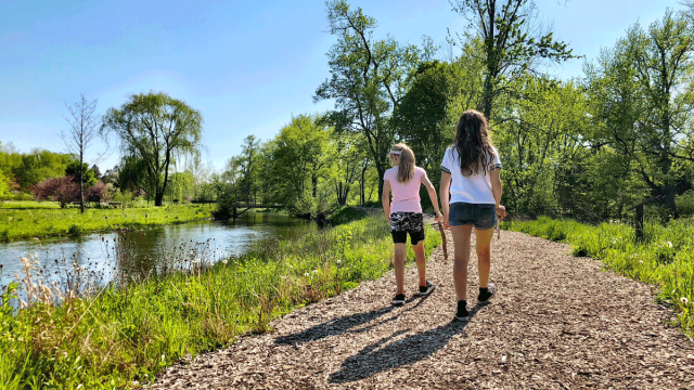 two girls hiking through Morton Arboretum in Chicago