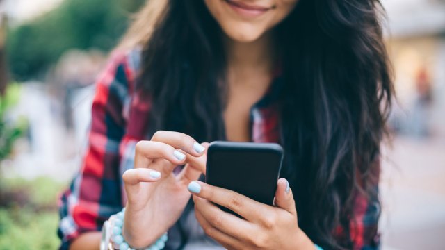 teen girl looking at her phone