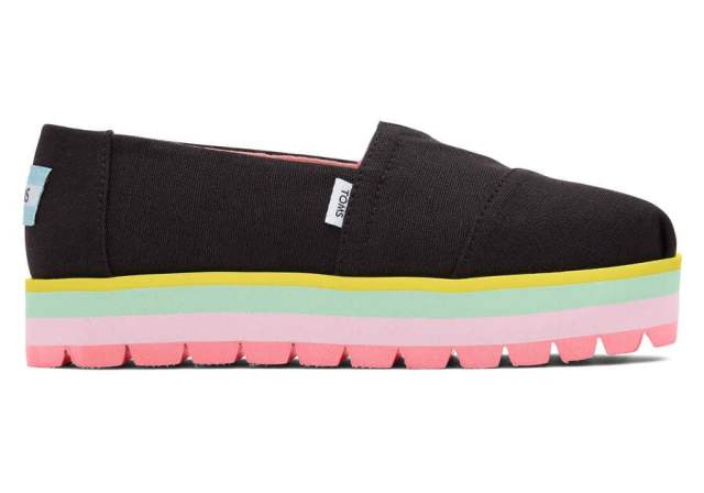 black canvas slip on kids shoe with rainbow platform