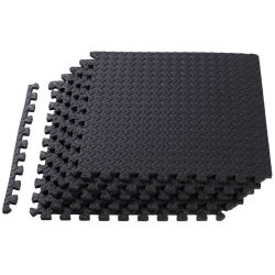 stack of black interlocking foam gym floor tiles
