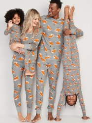 family of four wearing matching grey pajamas