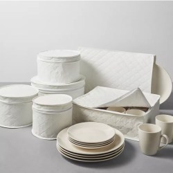Set of white quilted dish storage boxes and white dishes