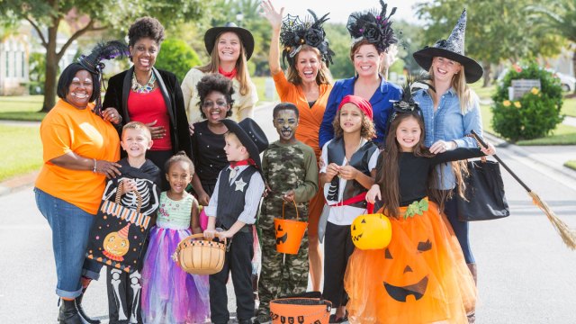 Moms and kids dressed up for Halloween