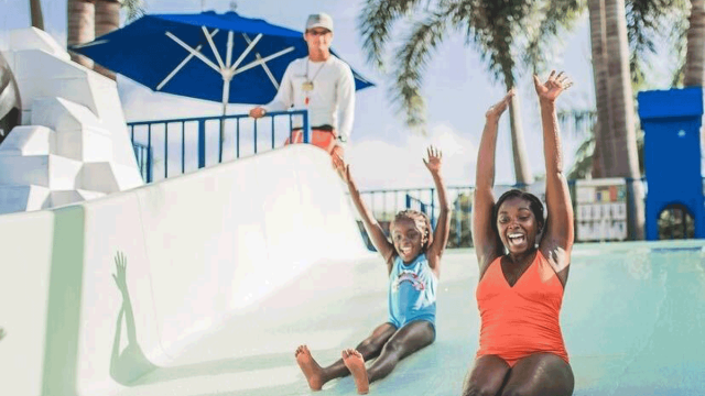 mom and child on waterslide at Florida all-inclusive resort