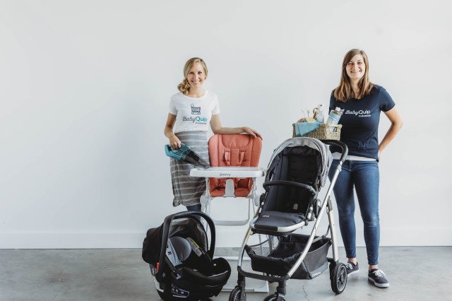 two women with baby gear and cleaning supplies