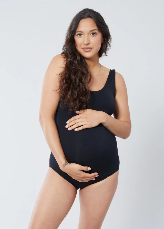 Woman wearing black maternity bodysuit