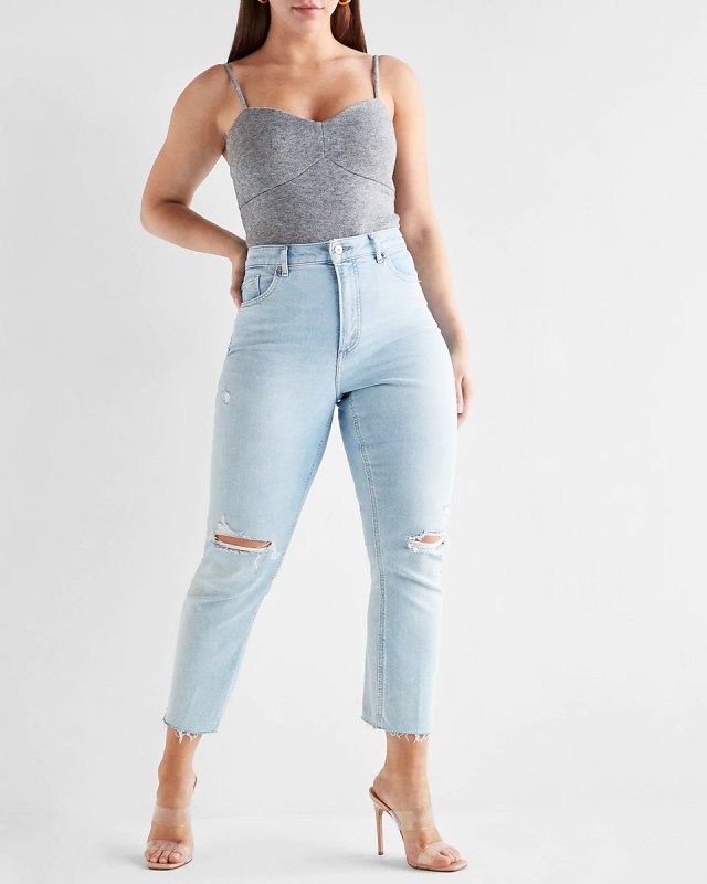 woman wearing high rise mom jeans