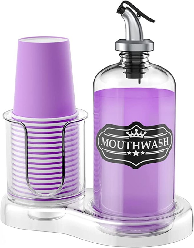 A mouthwash dispenser with a stack of cups