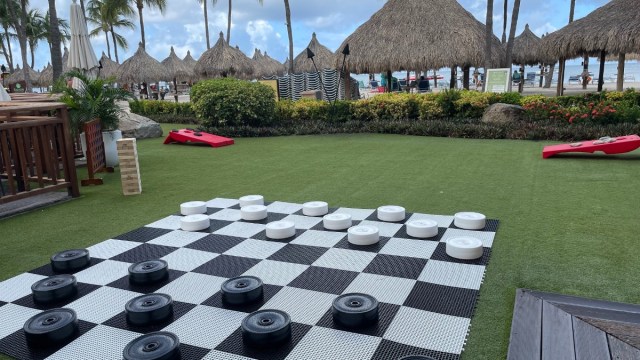 giant lawn games on the grass by the beach at Hyatt Regency Resort Aruba