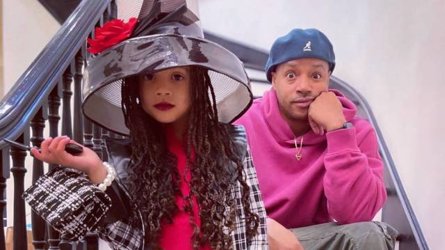 Donald Faison poses with his daughter, who is dressed as Dionne from Clueless