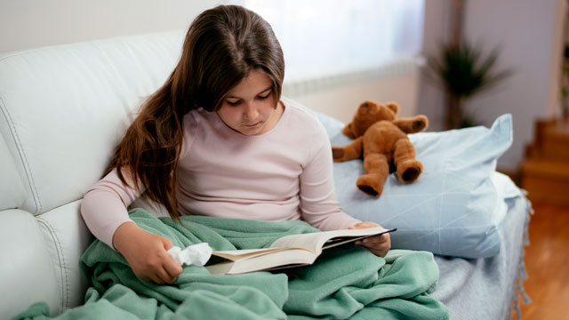 wondering what to do when sick? This little girl is having a sick day and she's reading books
