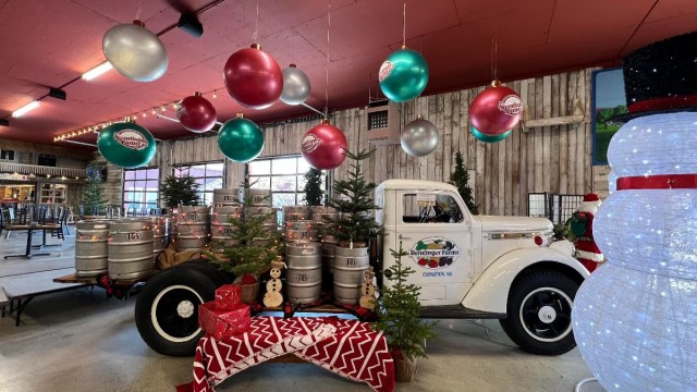 a truck at Remlinger Farms sits outside the Christmas decorated restaurants in Seattle that includes a train