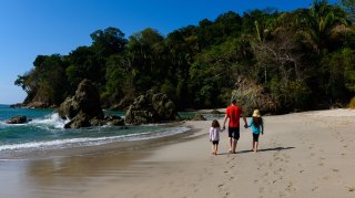 family walking on a beach in Costa Rica