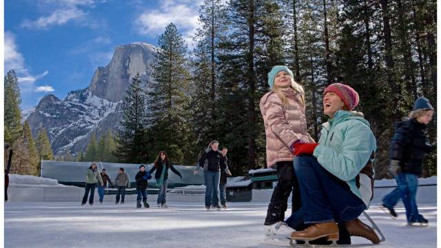 mother and daughter on ice rink at Yosemite