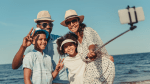 family taking a selfie on vacation after taking advantage of Costco travel deals